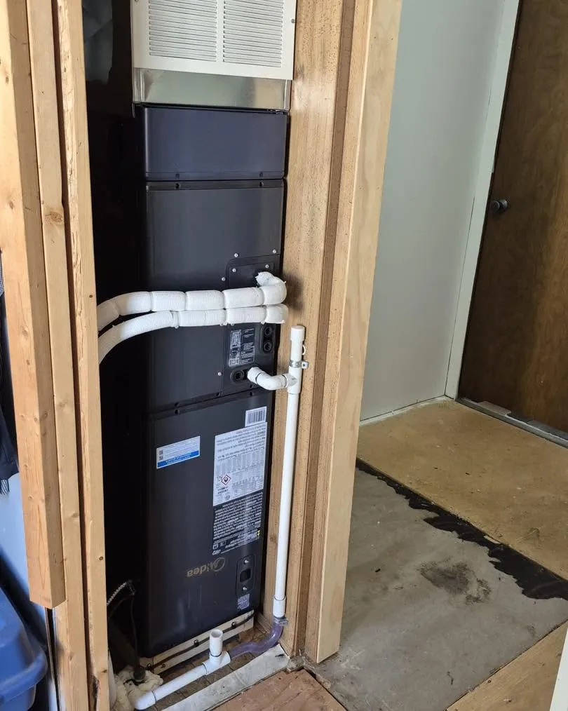 Midea air handler installed in a framed utility closet