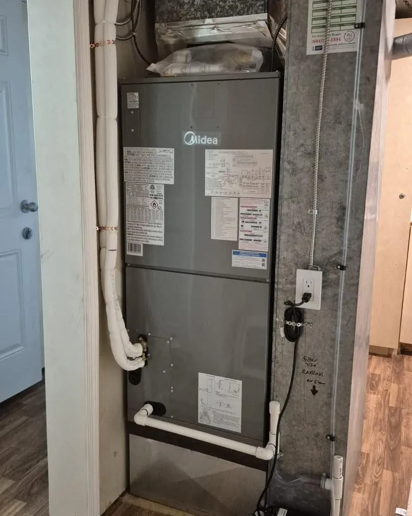 Midea air handler in a hallway closet